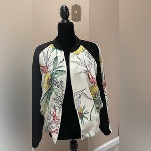 Bomber jacket. Black and beige with multicolor floral print. Size L.